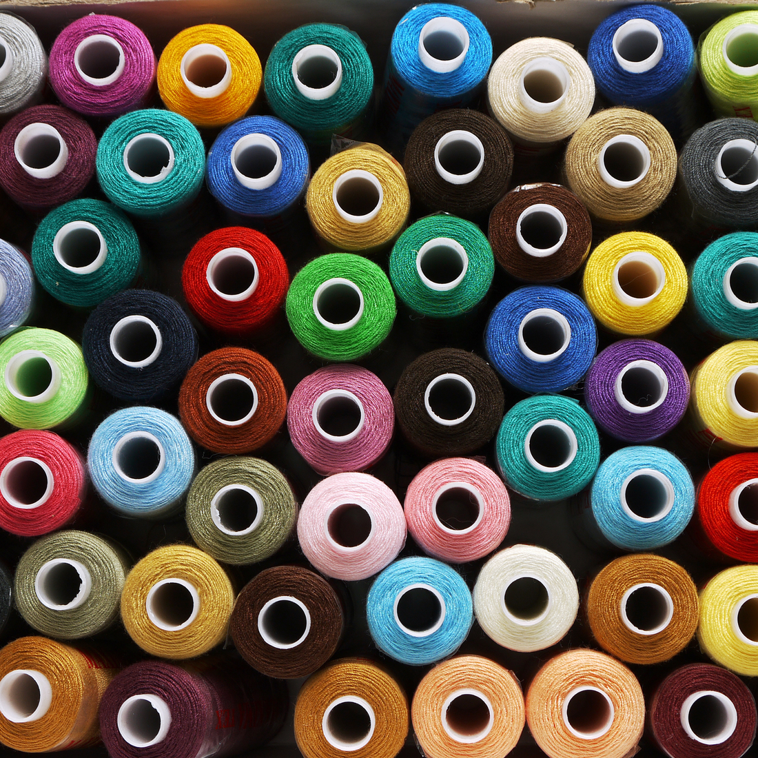 Spools of mercerised cotton threads of different colours